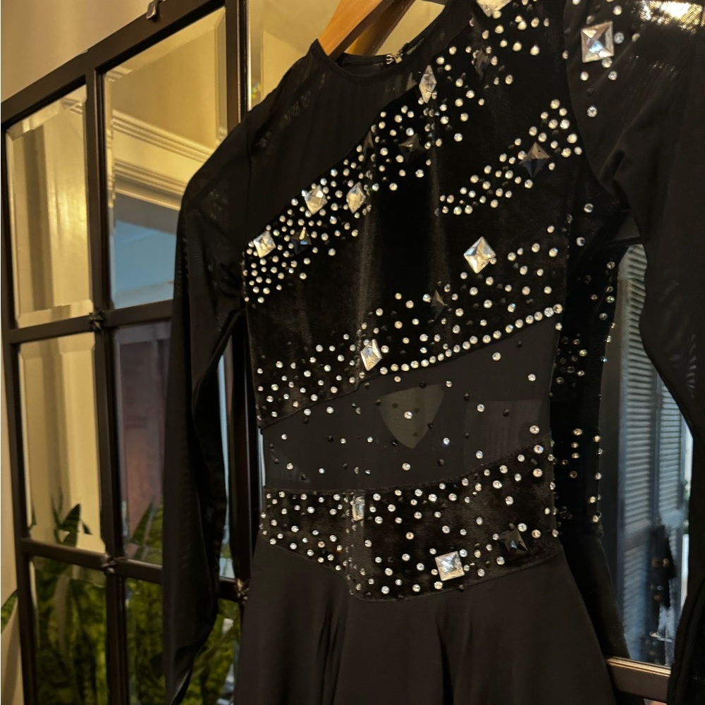 Figure Skating black/crystal angled dress. Long sleeve fingertip dress